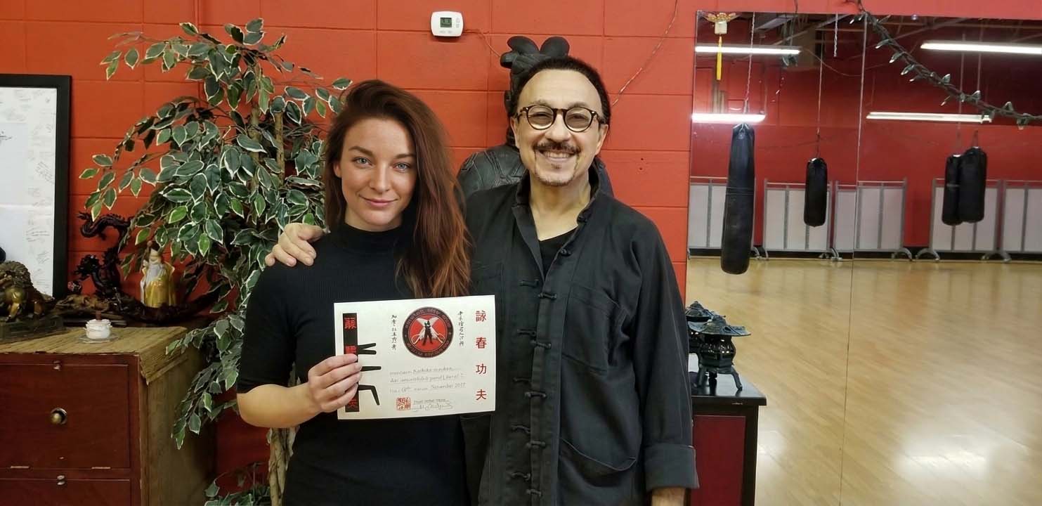 2019 Wing Chun Certification: Master Brian Lewadny presenting Sifu Kendra Mahon with her official verification archives.